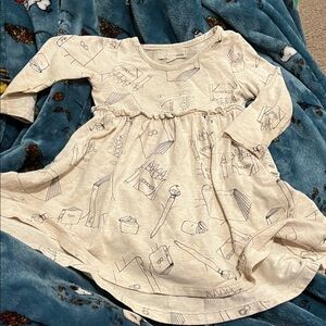 B1 “Greige.” Bamboo LS Skirted Bodysuit; Cream w/ Grey Learning Cartoon Print